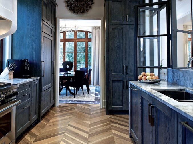 Rustic kitchen with bluew walls and hardwood floor